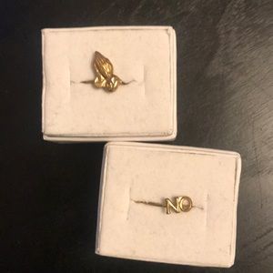 Prayer hands and “NO” rings